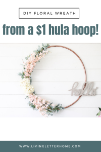 DIY your own spring hoop wreath from a $1 hula hoop! #springdecor #springwreath #DIYhoopwreath