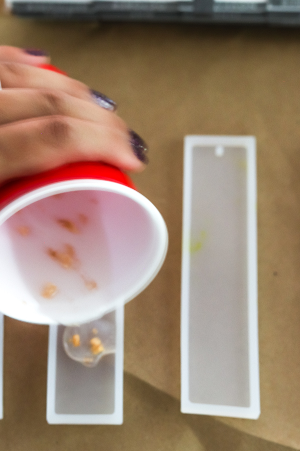 pouring resin into bookmark mold