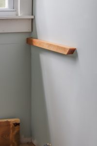 2x2 wood bracket on the wall