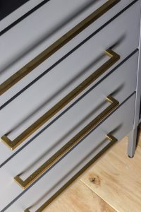 added long brass pulls to Ikea AURDAL closet system in gray
