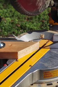 scrap piece of wood on table saw