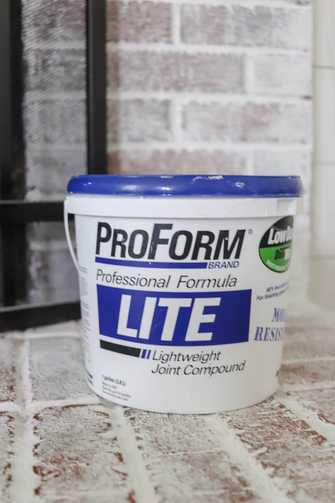 tub of ProForm lite joint compound sitting on fireplace