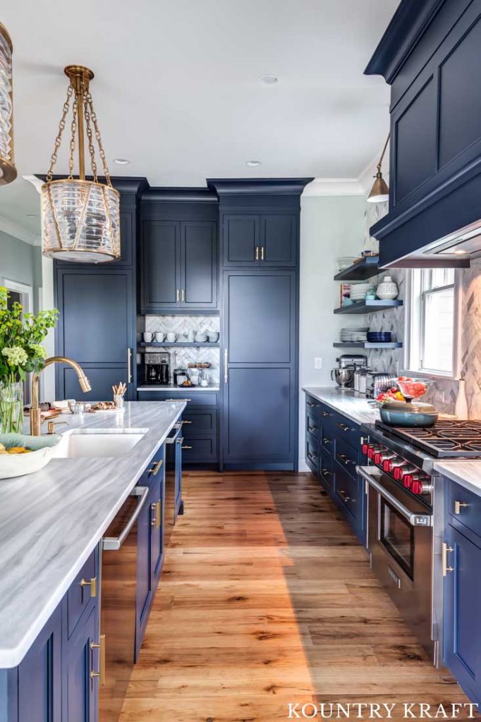 benjamin moore hale navy kitchen cabinets with wood floors and large island
