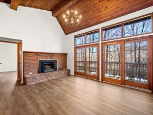 large french doors in living room with brick fireplace