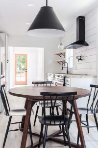 white shiplap in kitchen with black range hood