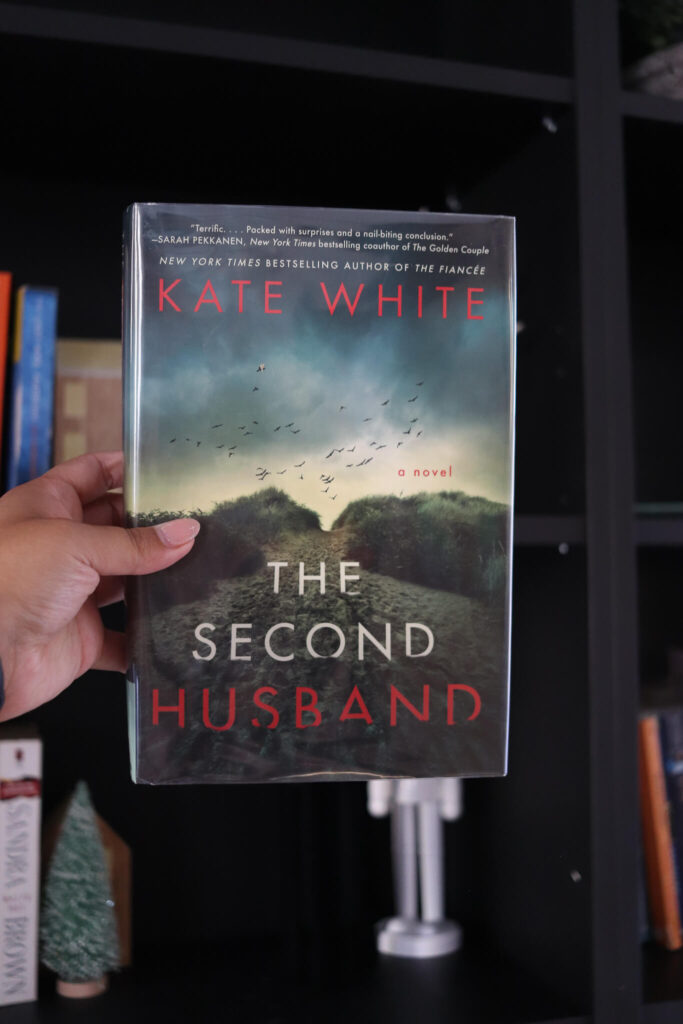 woman's hand holding the second husband by kate white