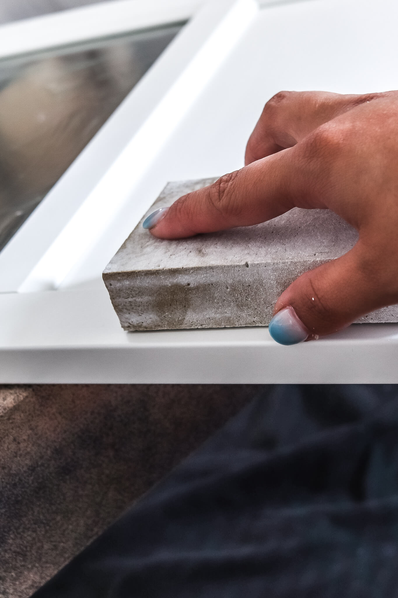 closeup of woman's hand sanding