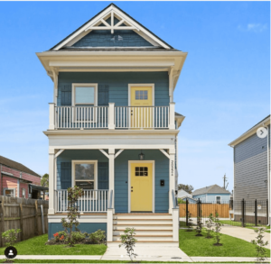 charleston style home with yellow front doors and painted benjamin moore aegean teal siding