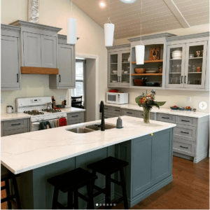 benjamin moore aegean teal island in kitchen with white cabinets