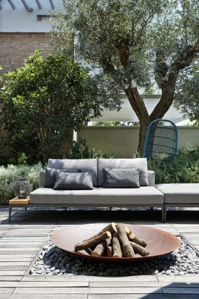 backyard deck with firepit and wood in it