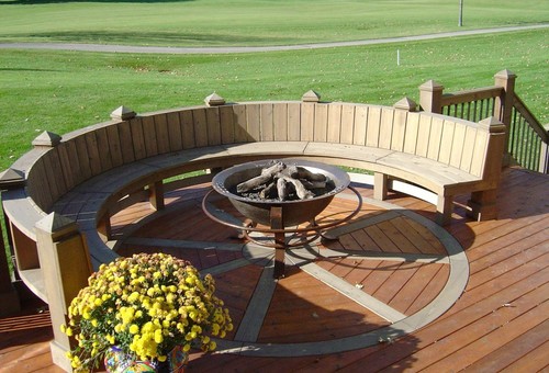 curved back deck with firepit in the middle