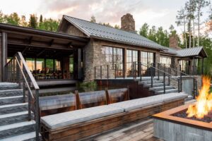 huge back deck with water feature and fire pit in the middle