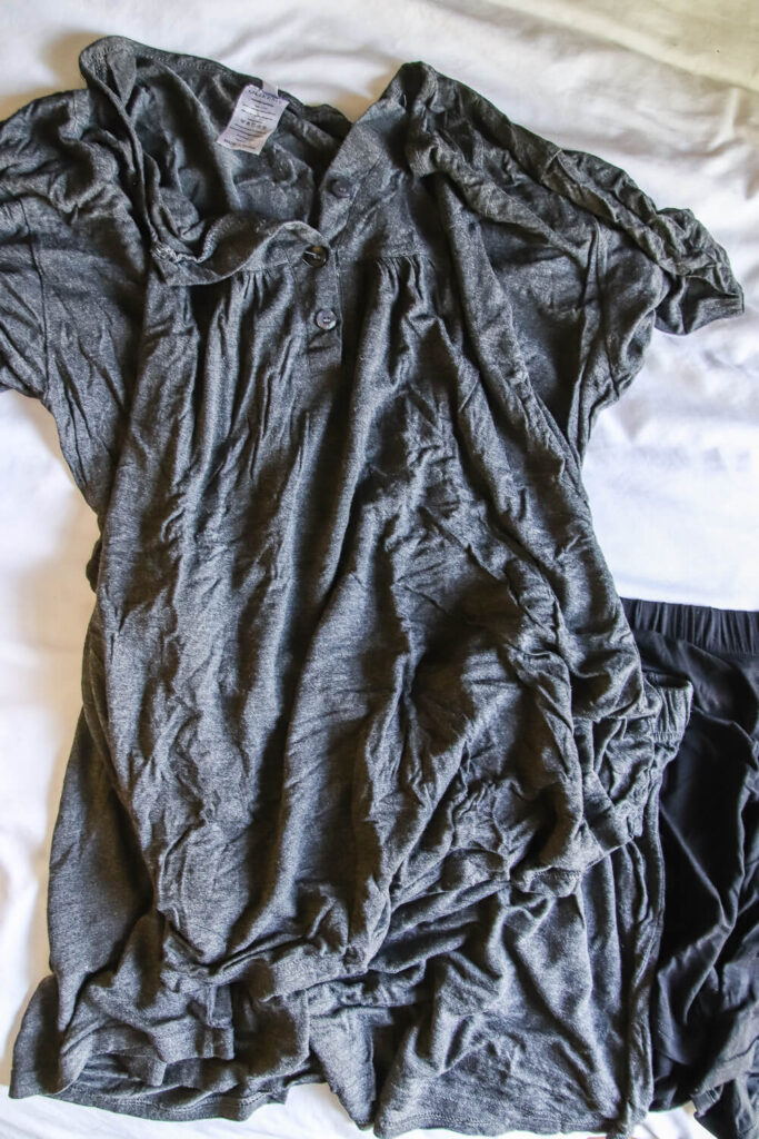 gray bamboo pajama set for women laying on white comforter