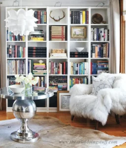 white bookshelves styled with books on them
