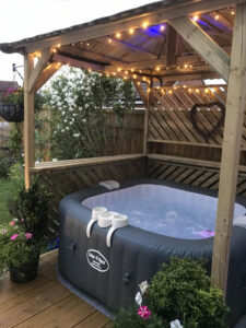 inflatable hot tub deck with a pergola on top