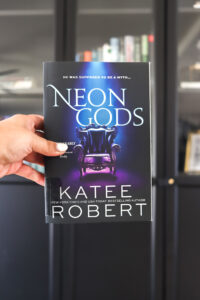 woman holding neon gods katee robert review