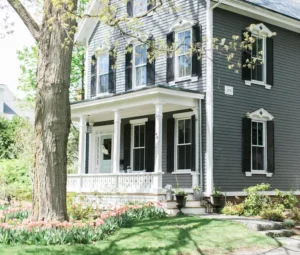 farmhouse style home with tulips landscaping