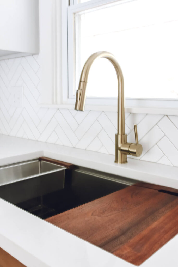workstation sink with gold faucet