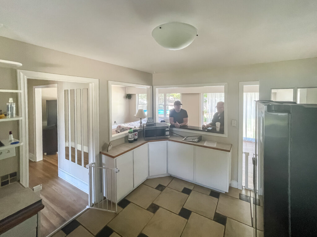 kitchen with white cabinets and tile floor