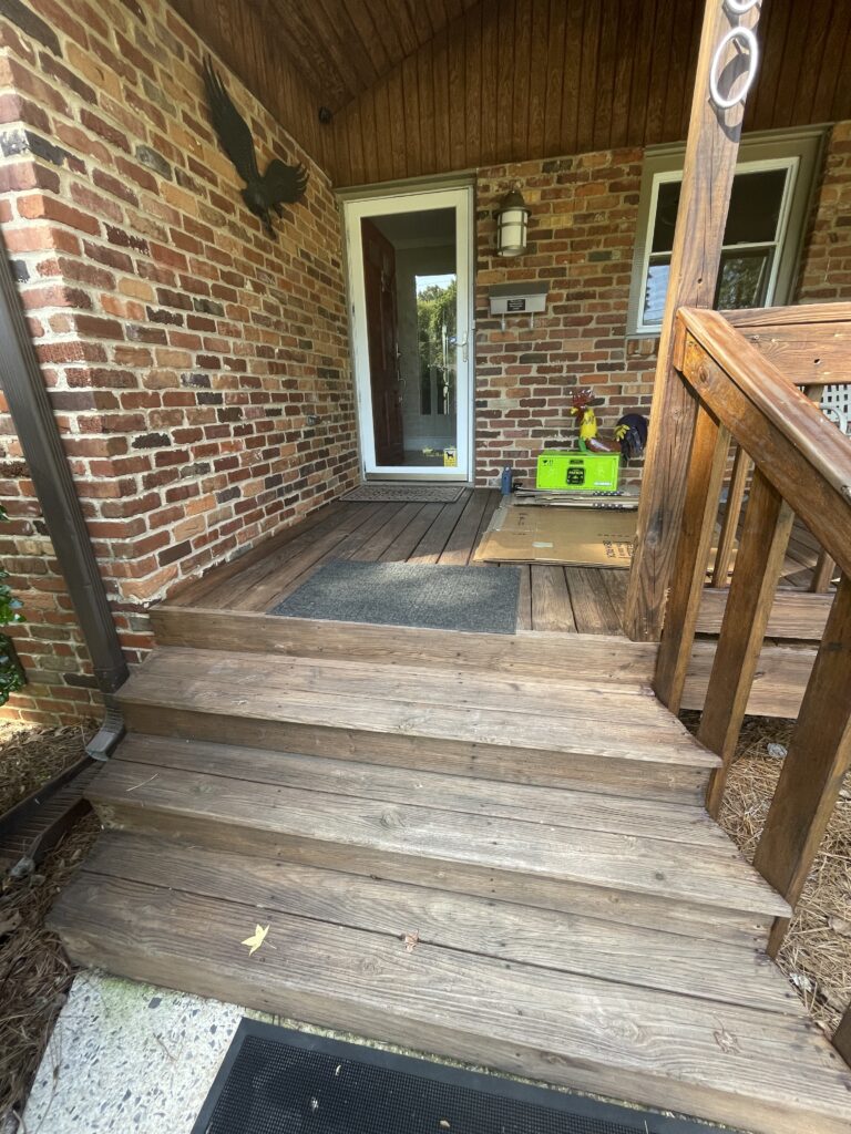 front porch closeup on the exterior of a small brick ranch home