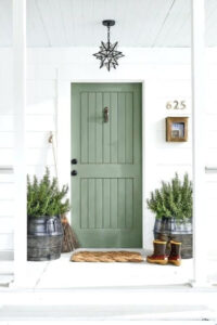small front porch with white siding and front door painted sherwin williams rosemary