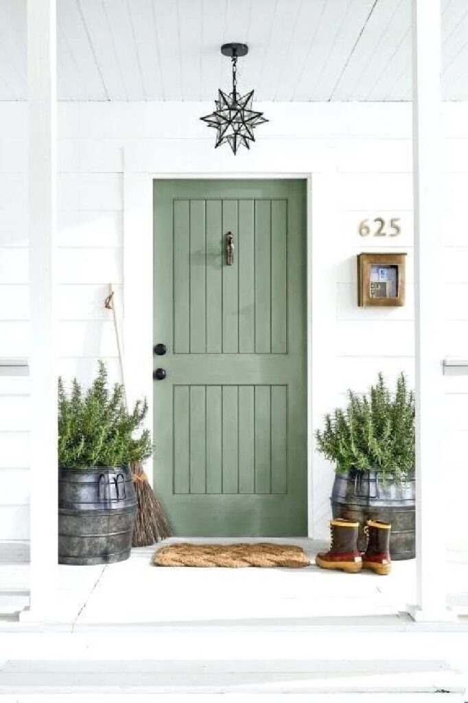 small front porch with white siding and front door painted sherwin williams rosemary
