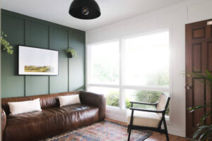 home office with leather sofa and board and batten accent wall painted sherwin williams rosemary
